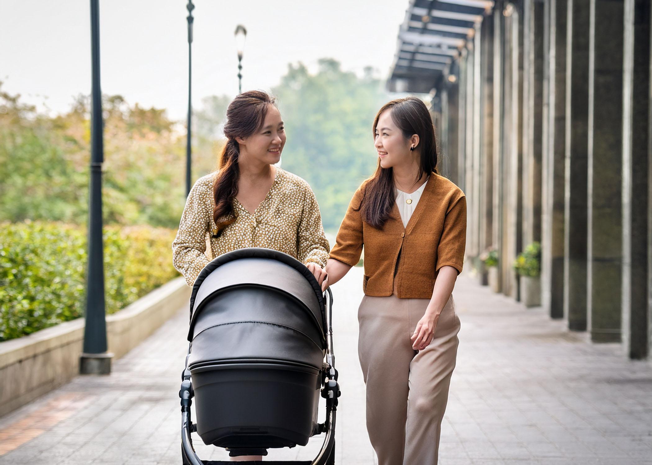 lesbian couple pushing pram