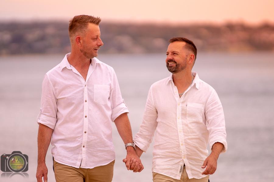 Gay couple posing for pre-wedding photoshoot in Frankston beach