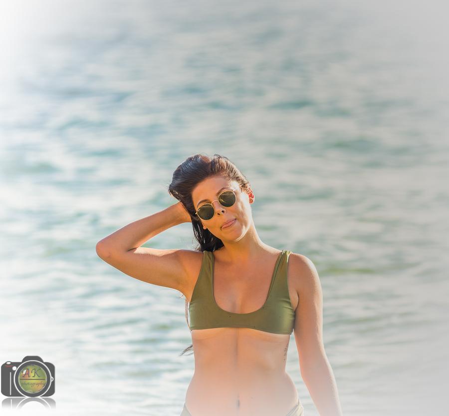 Beautiful woman at the beach posing for camera
